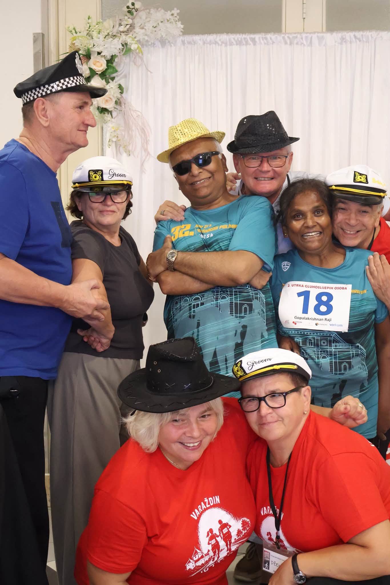 Race guests and volunteers smiling together during a gathering.
